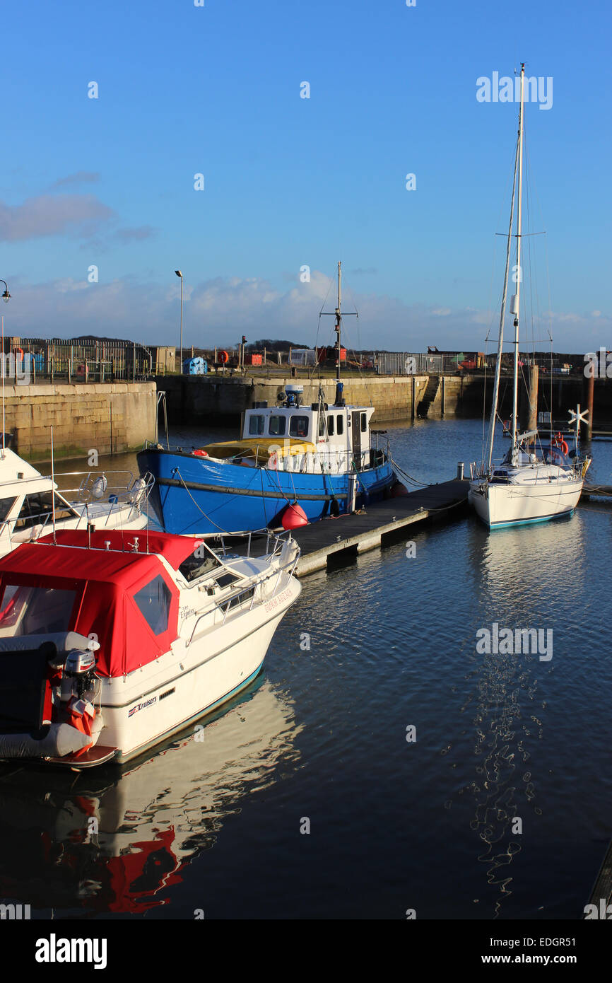 Assorted boats moored in Fleetwood Dock (now a Marina) adjacent to freeport shopping area, Fleetwood, Lancashire, England. Stock Photo