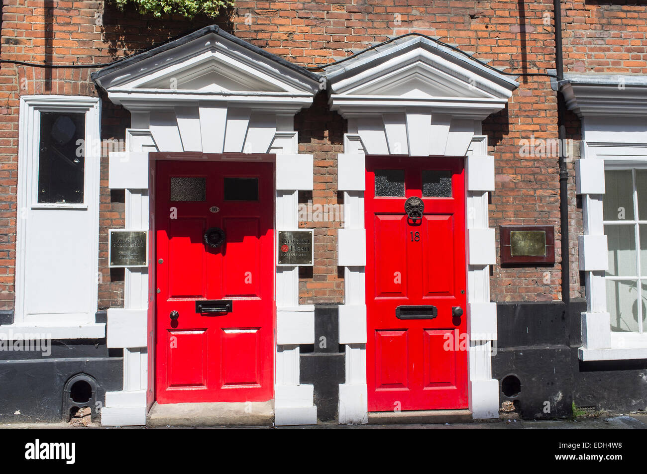 Two Red Painted Doors in Princes Street Norwich Norfolk England Stock Photo