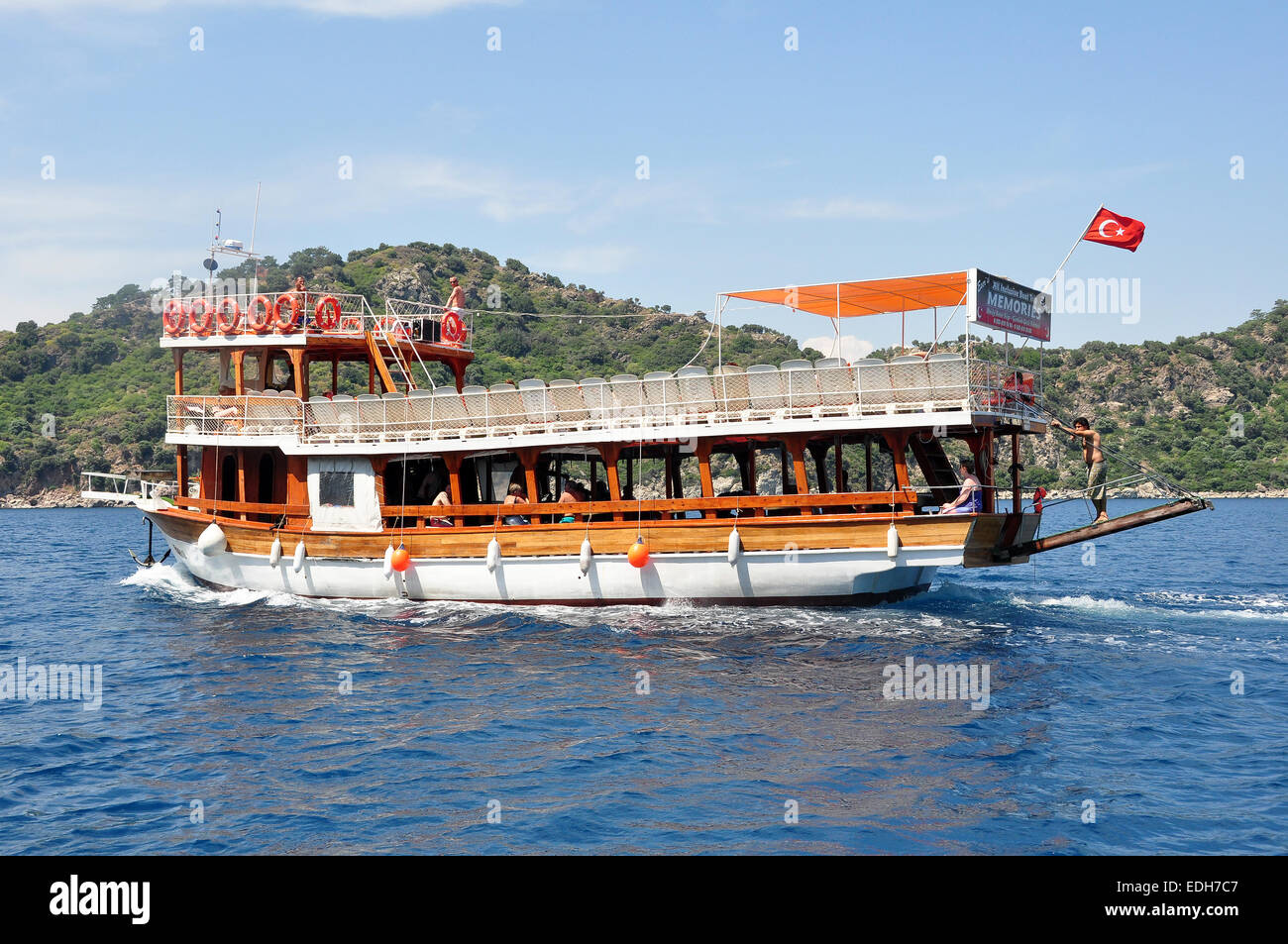 A wooden tourist boat from Marmaris  on the way to Turunc for tourists to visit the local market. Stock Photo