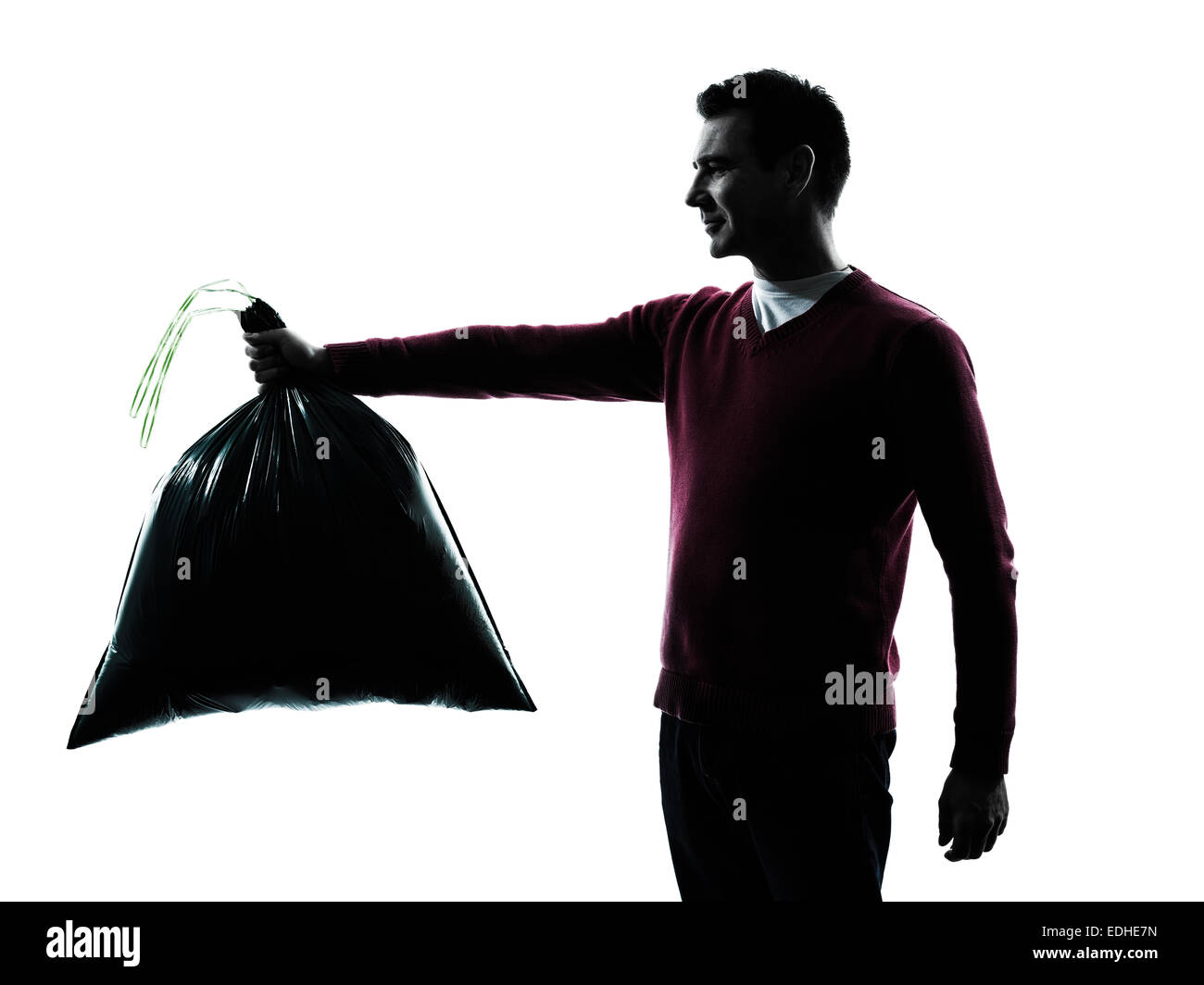 man dumping garbage bag in silhouettes on white background Stock Photo