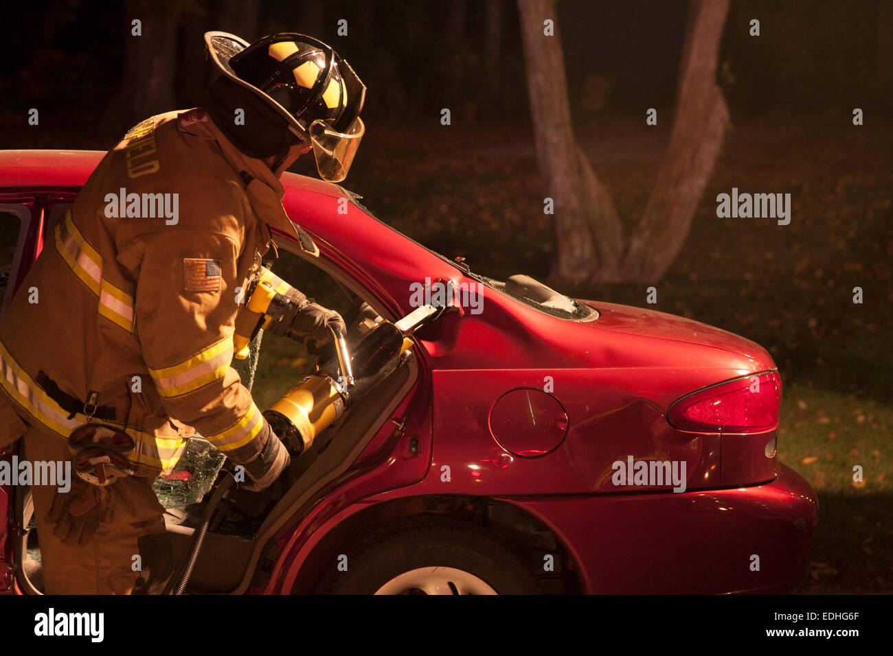 Richfield Fire Department firefighter performing extrication demonstration on a vehicle Stock Photo