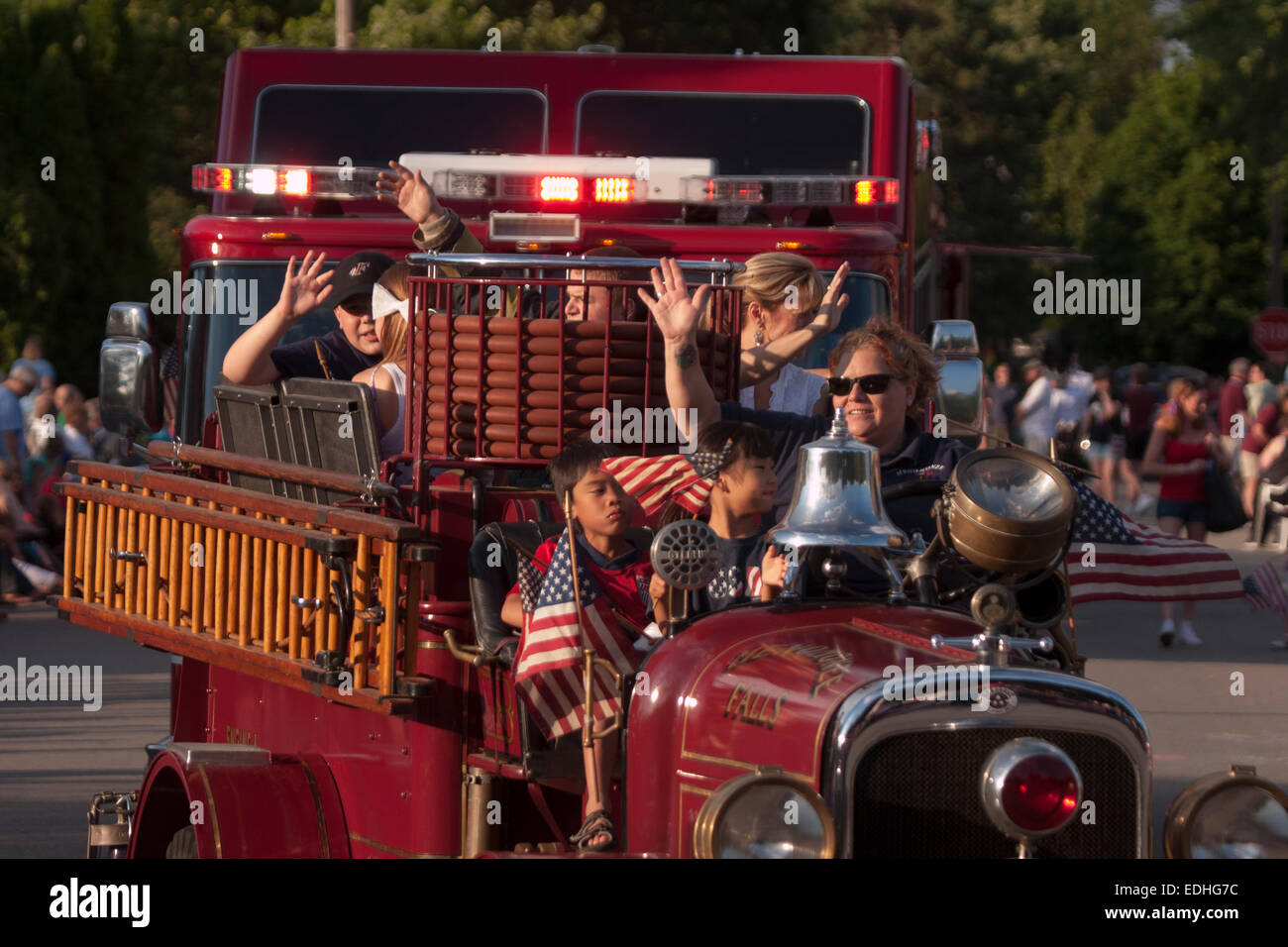 Antique firetruck in a Fourth of July parade in Menomonee Falls WI Stock Photo