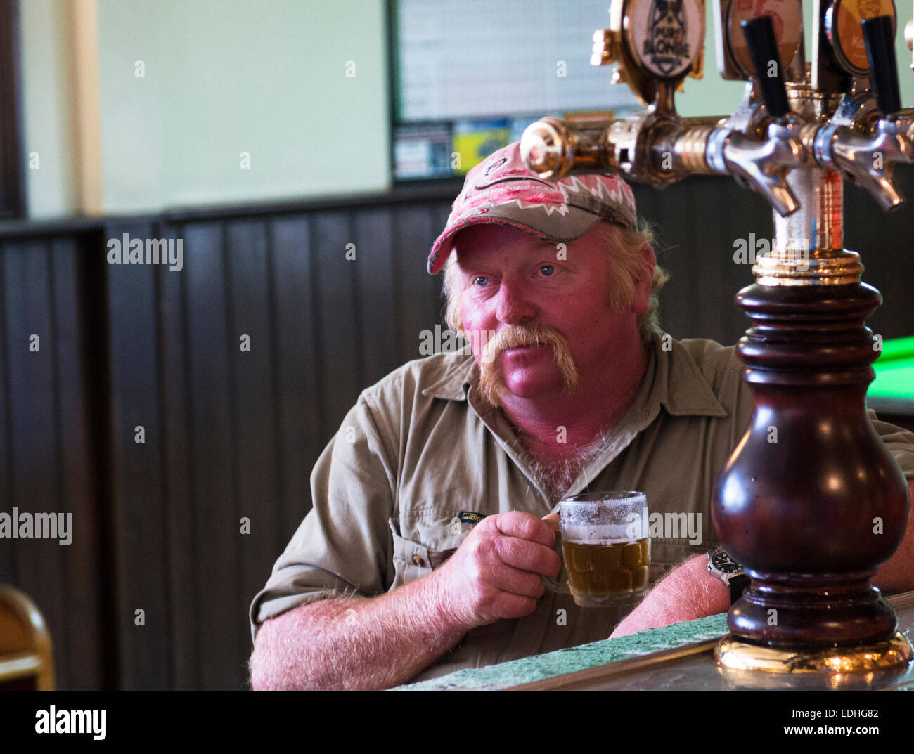 Local Aussies enjoying a beer in a local pub in Scottsdale, Tasmania. Stock Photo