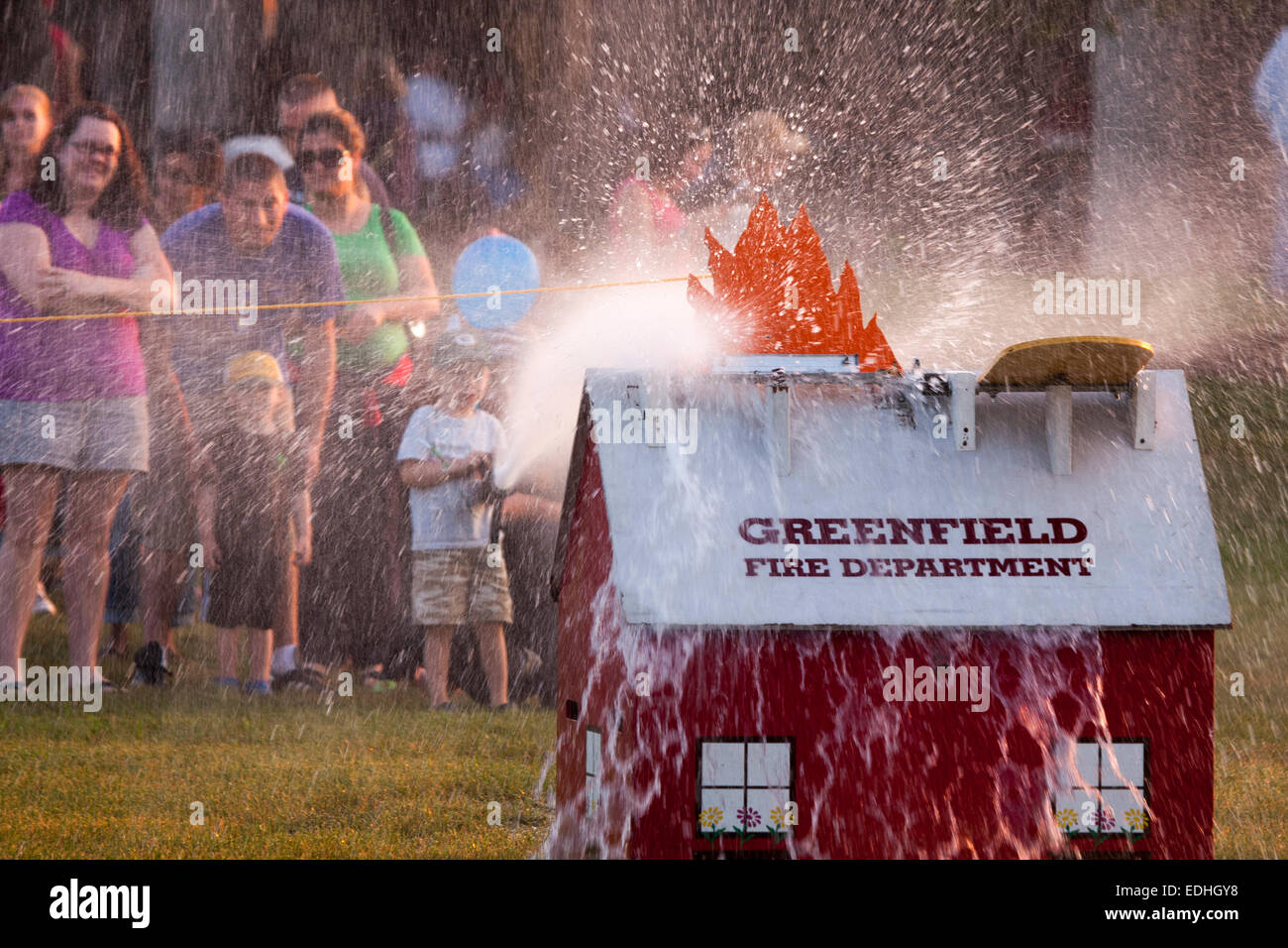 Little boy spraying water hose hires stock photography and images Alamy