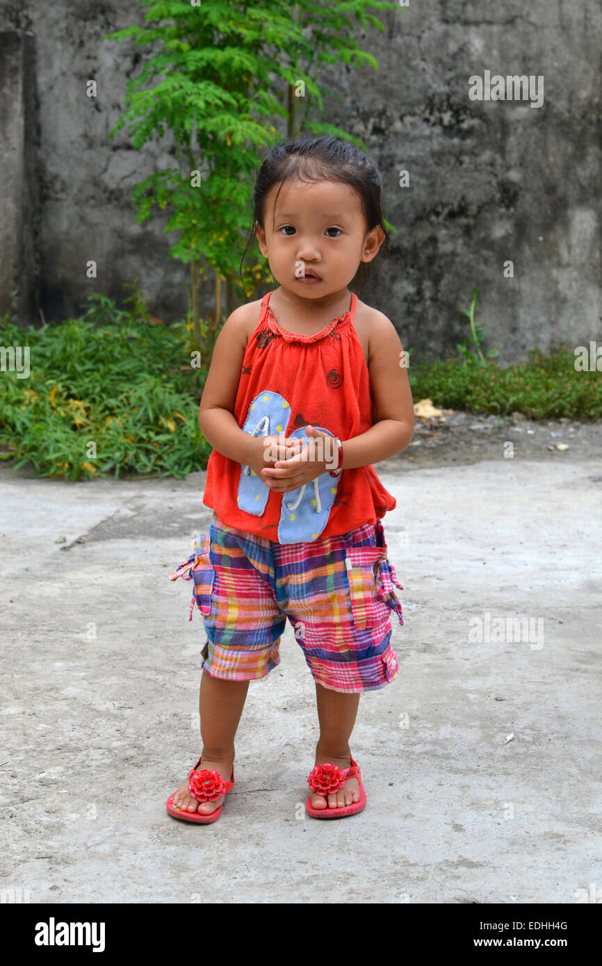 A full body portrait of beautiful asian little girl with innocent eyes Stock Photo