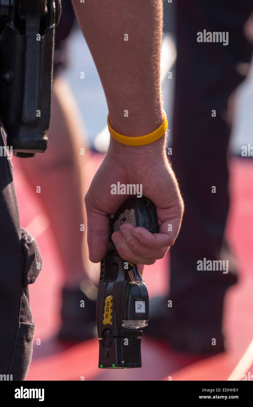 Germantown Police Officer holding a taser on a suspect Stock Photo