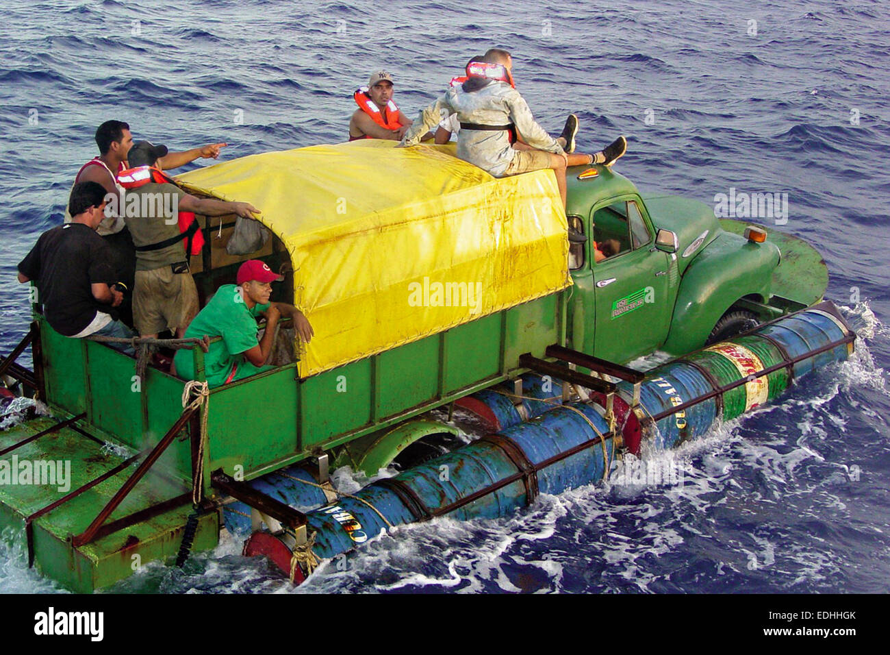 A makeshift boat made from an old Chevy flatbed truck rigged with pontoons carrying 11 Cuban migrants is intercepted by the U.S. Coast Guard July 17, 2005 in the Straits of Florida. Stock Photo