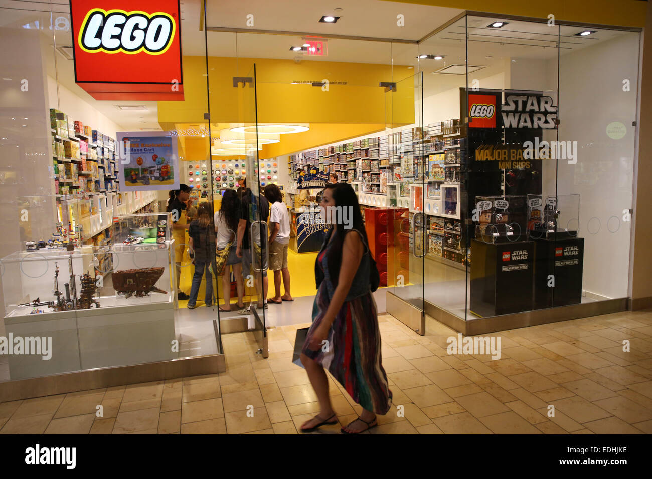 Mission Viejo, California, USA. 08th June, 2014. The Lego store front in Shops at Mission Viejo mall. Lego is a popular line of construction toys manufactured by The Lego Group, and consists of colourful interlocking plastic bricks and an accompanying array of gears, minifigures and various other parts. Anything constructed can then be taken apart again, and the pieces used to make other objects. Lego began manufacturing interlocking toy bricks in 1949. Since then a global Lego subculture has developed, supporting movies, games, competitions, and six themed amusement parks. As of 2013, around Stock Photo