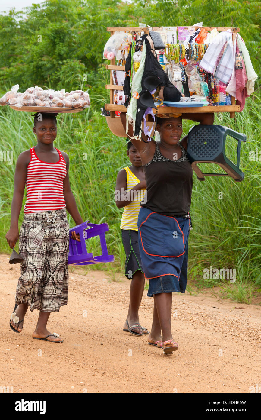 Hawkers carrying goods on their head, rural Ghana, Africa Stock Photo