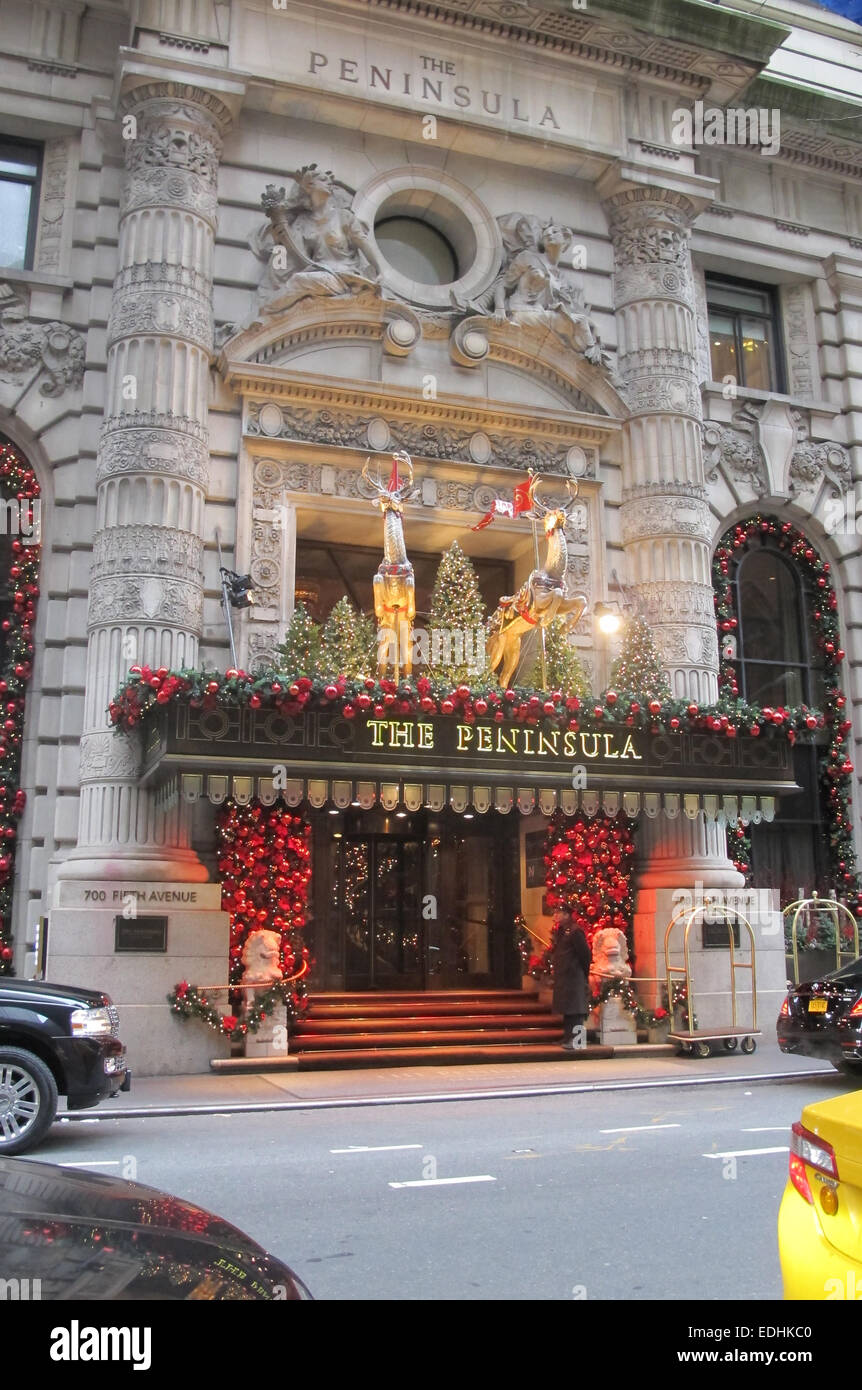 The front entrance to the Peninsula hotel at Christmas decorated with