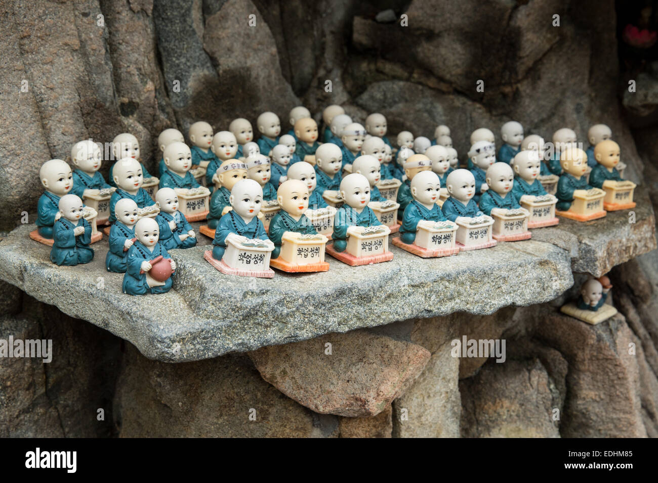 Porcelain figurines of monks at a temple in South Korea Stock Photo