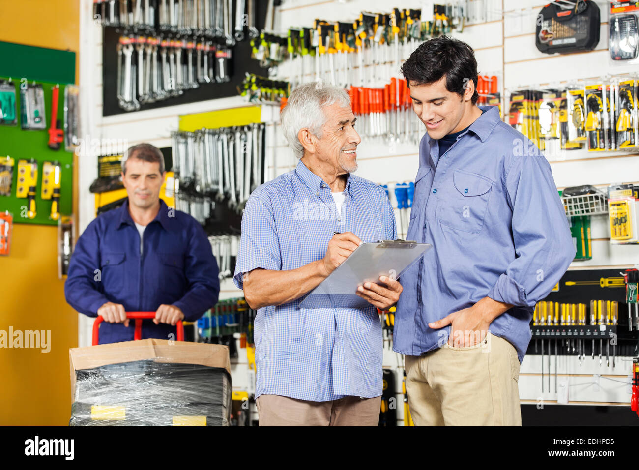 Customers Checking Checklist In Hardware Store Stock Photo Alamy