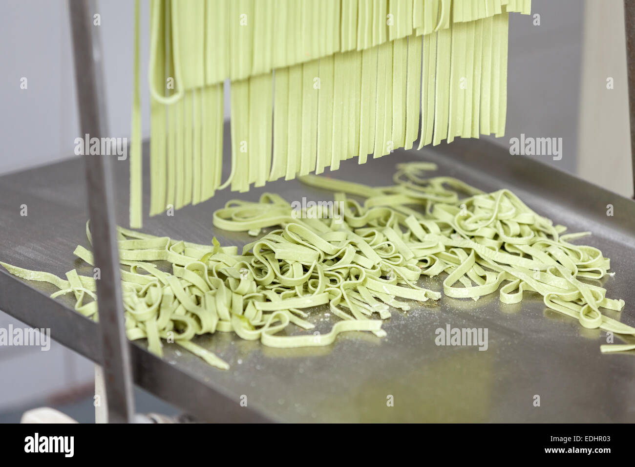 Processed Spaghetti Pasta On Machine Tray Stock Photo