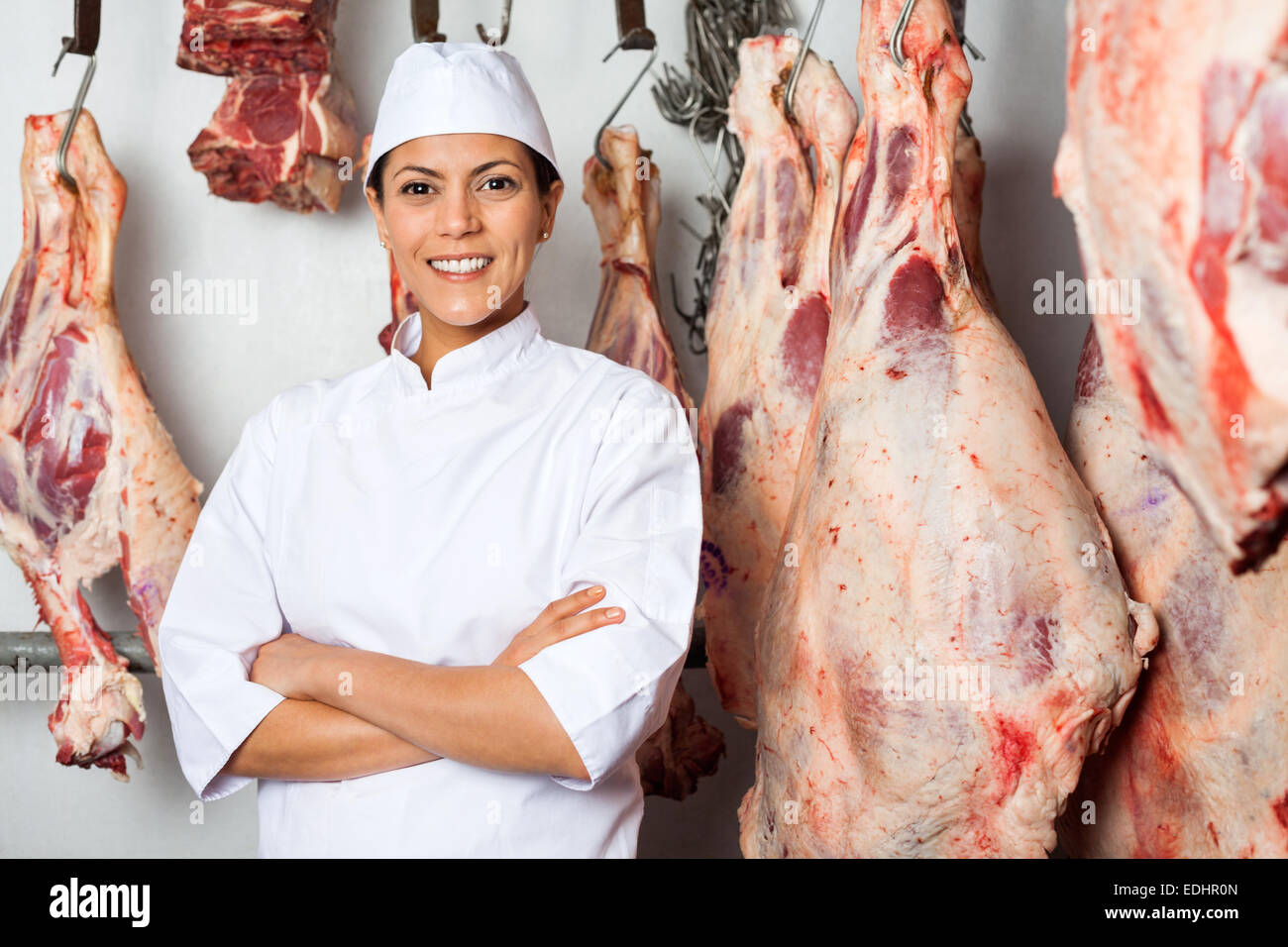 Butcher Standing Arms Crossed In Slaughterhouse Stock Photo Alamy