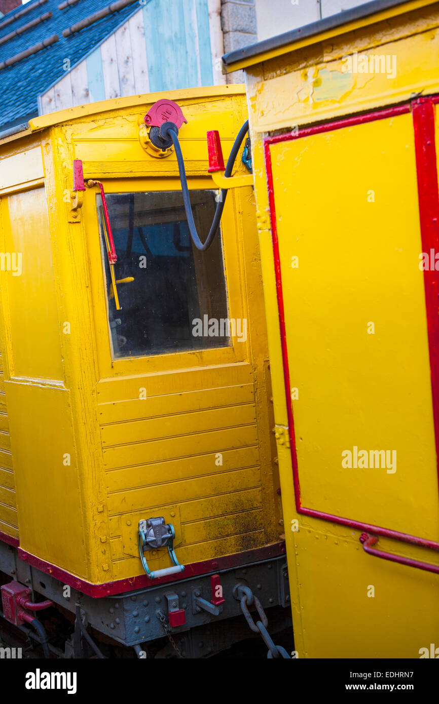 Wagons of the Train Jaune, Yellow Train, Canari, or Ligne de Cerdagne, at the Mont-Louis - La Cabanasse station. Stock Photo