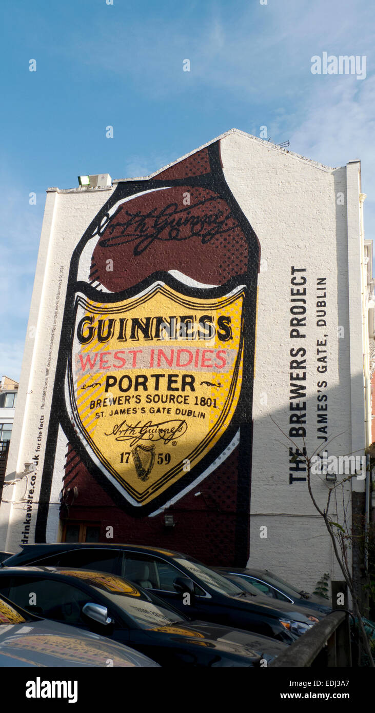 Guinness West Indies Porter wall mural advertisement on the side of a building in Clerkenwell London, UK  KATHY DEWITT Stock Photo
