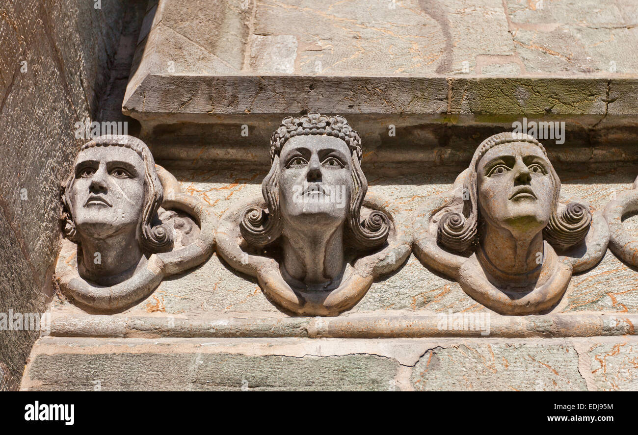 Head sculptures on east facade of Stavanger Cathedral (Stavanger domkirke, circa XIII c.), the oldest church in Norway Stock Photo