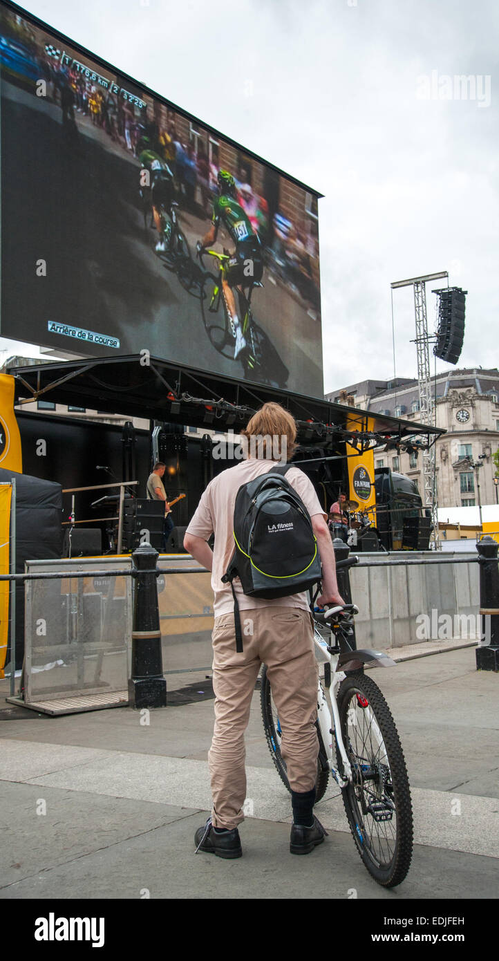 Londoners watch the Tour de France from the Fun Park in London's Trafalgar Square  Featuring: sports fans,spectators,cyclist Where: London, United Kingdom When: 05 Jul 2014 Stock Photo