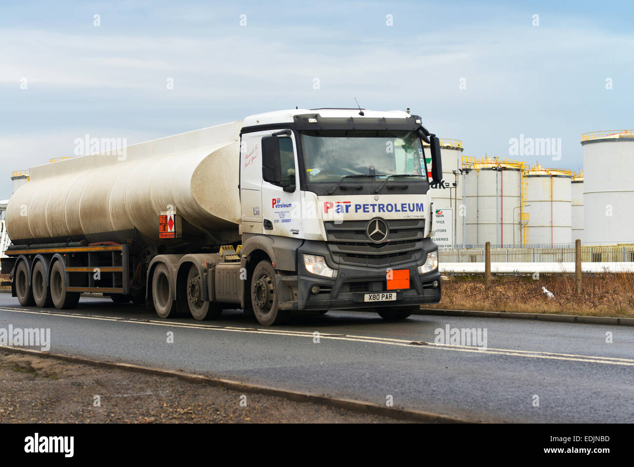 Seal Sands Oil Terminal, Teesside, UK. 7th January 2015. A petrol tanker leaves the Vopak Terminal at Seal Sands on Teesside to distribute petrol to a network of petrol stations across the UK. Brent crude oil has hit its lowest price since May 2009 and has fallen below $50 per barrel. Stock Photo