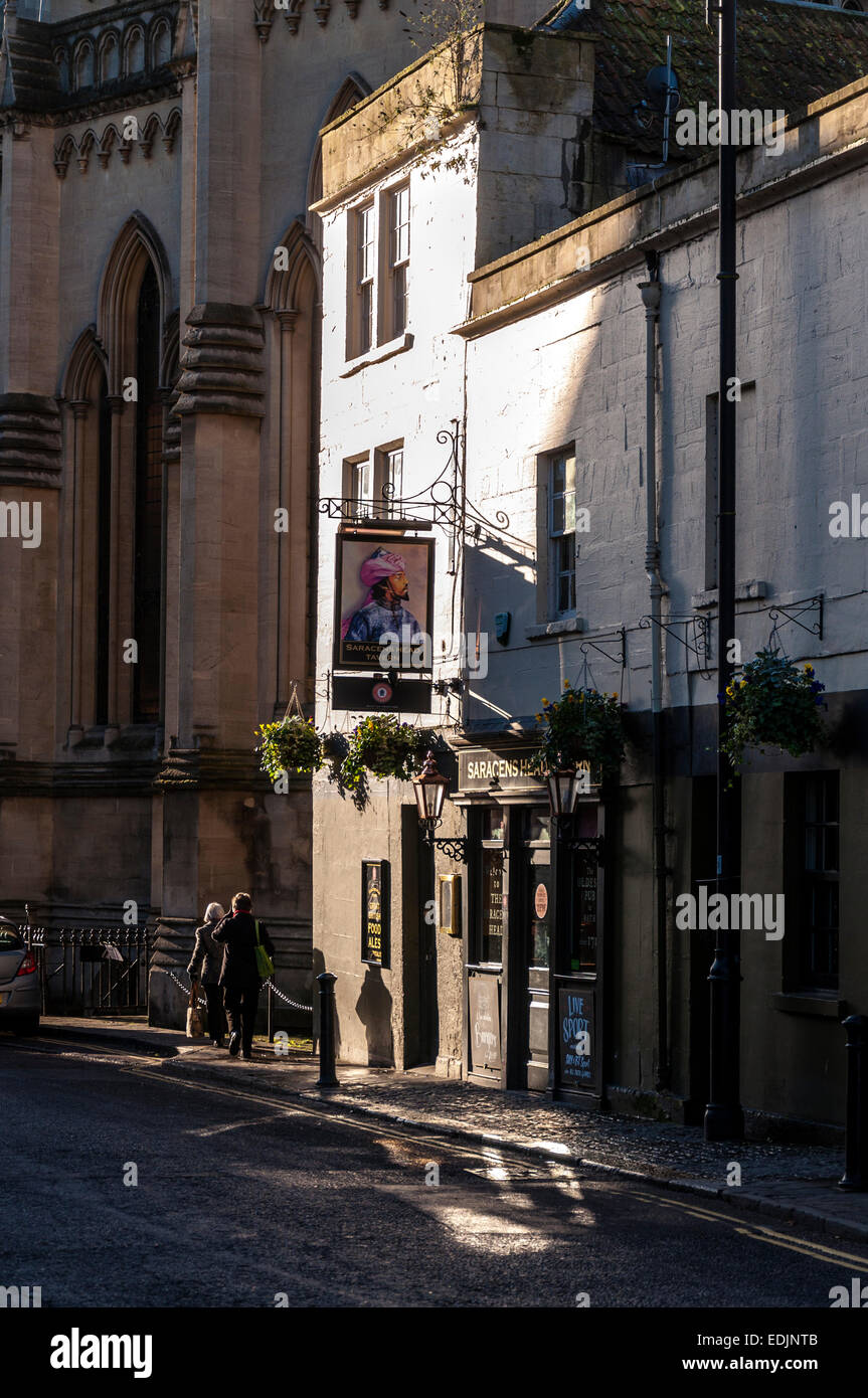 Architecture in Bath Somerset on Walcot Street with Saracens Head Tavern illuminated by winter sunlight Stock Photo