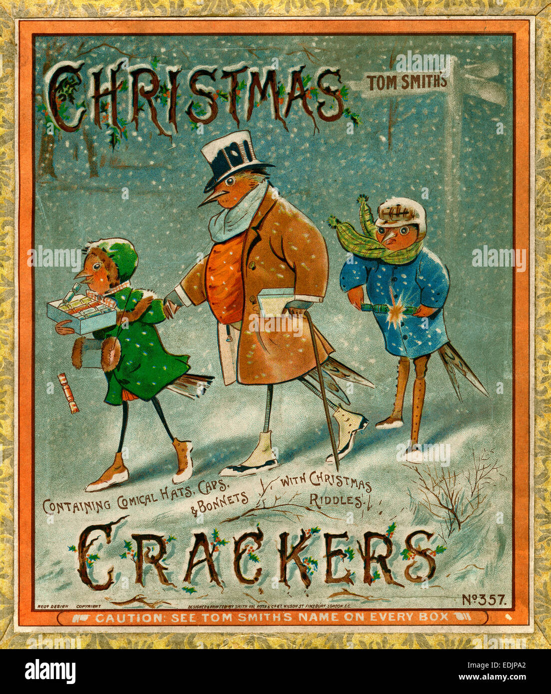 Old box of Victorian Christmas crackers featuring an illustration of birds in the snow carrying - and pulling - the crackers Stock Photo