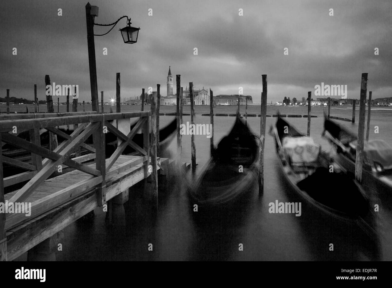 Black and white image of gondolas at the dock in Venice, Italy Stock Photo