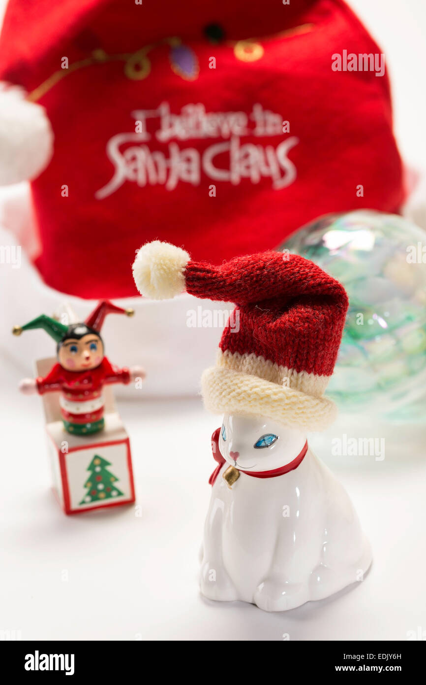 Fat White Santa Kitty and Jack- in -the- Box Christmas Ornaments Still-Life, USA Stock Photo