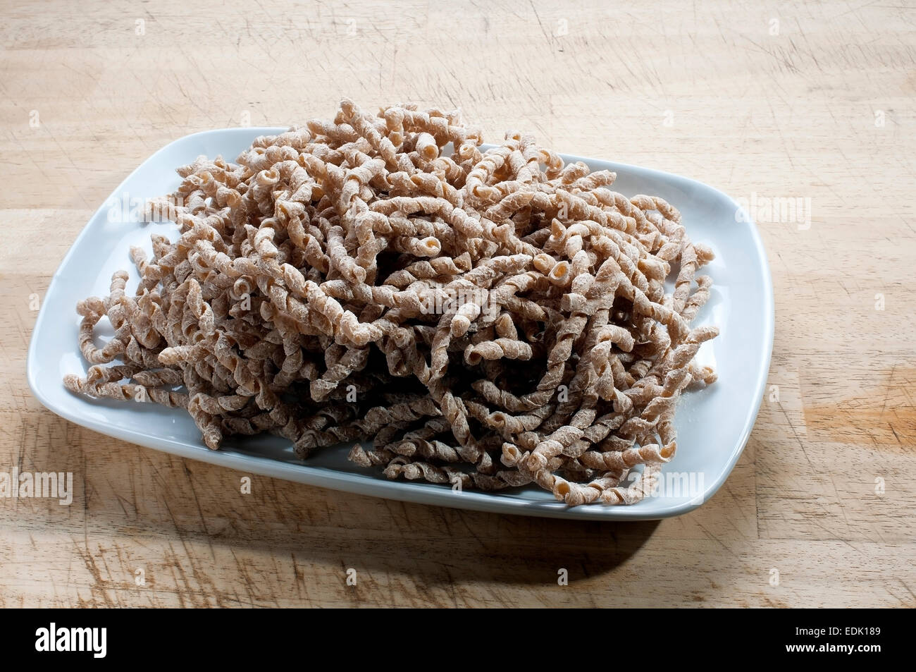 corkscrew shaped raw pasta with whole wheat flour, buckwheat typical of Sicily Stock Photo