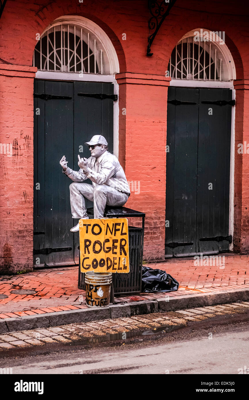 A man covered in silver paint expresses his feeling towards Roger Goodell seen in New Orlenas LA Stock Photo