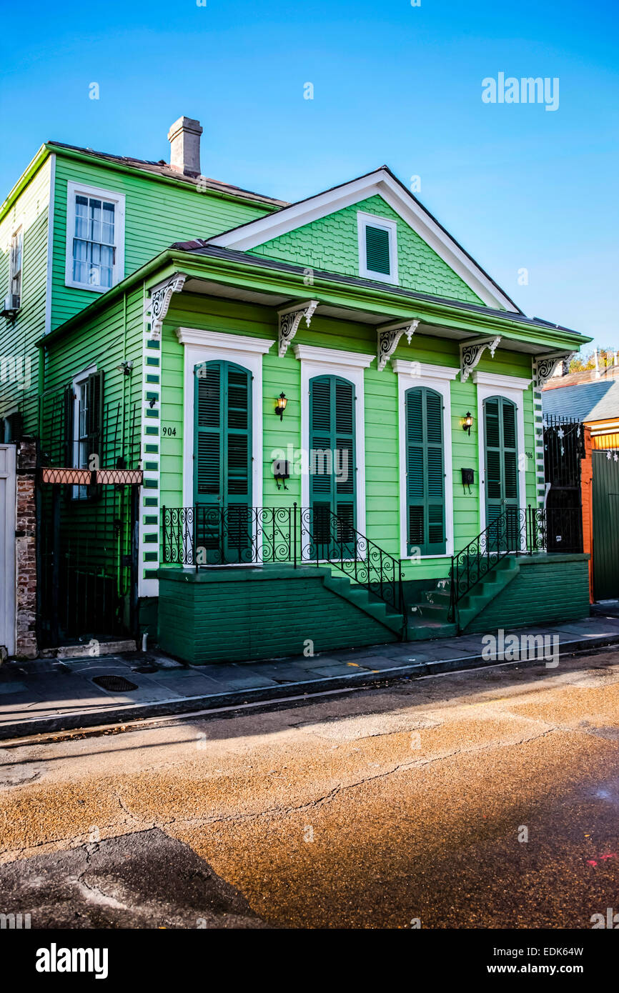 A brightly green painted house in the French Qtr of New Orleans LA