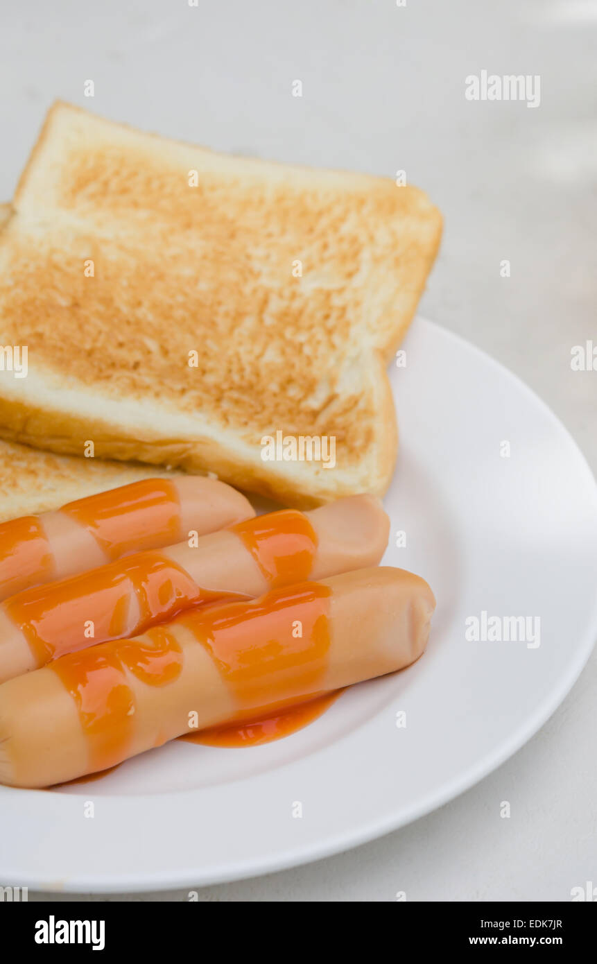 sausage with sauce and  toast bread  on a plate Stock Photo