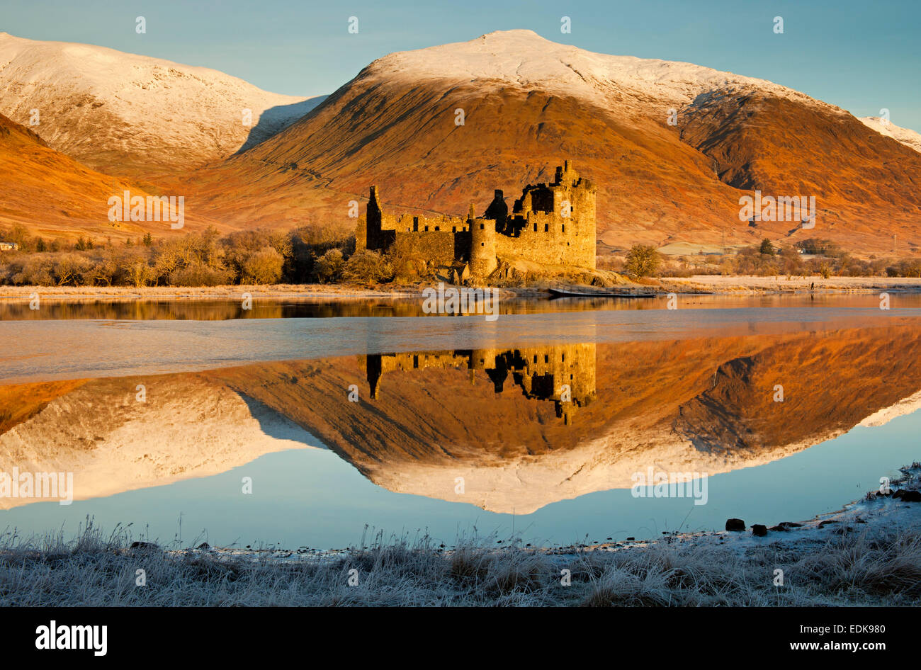 Kilchurn Castle reflected in Loch Awe, with  Snowcapped mountains Argyll and Bute, Scotland UK Stock Photo