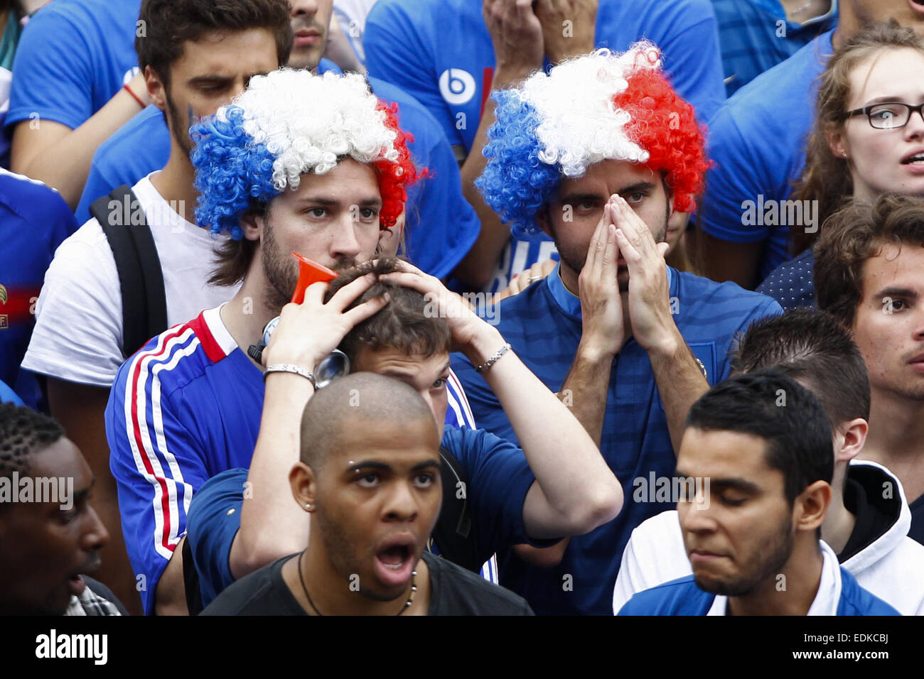 Soccer fans watch the France v Germany Quarter Final match on giant