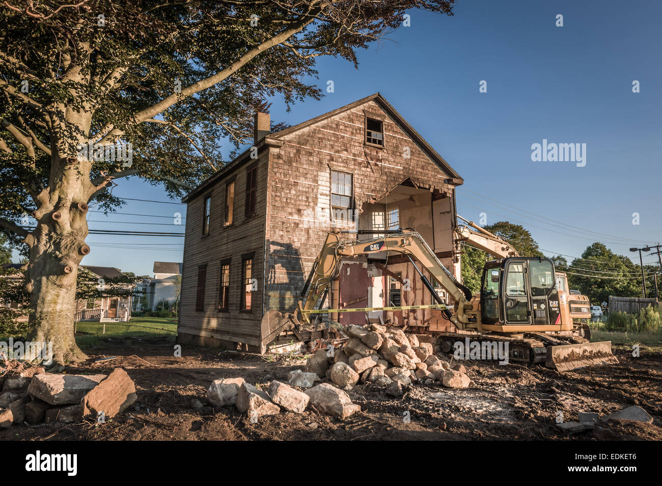 A three hundred year old house awaits the final act in its demolition - Falmouth, Massachusetts, USA. Stock Photo