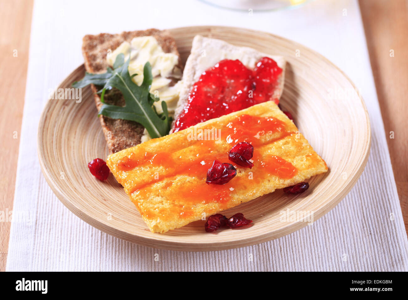 Crisp bread with butter and jam Stock Photo