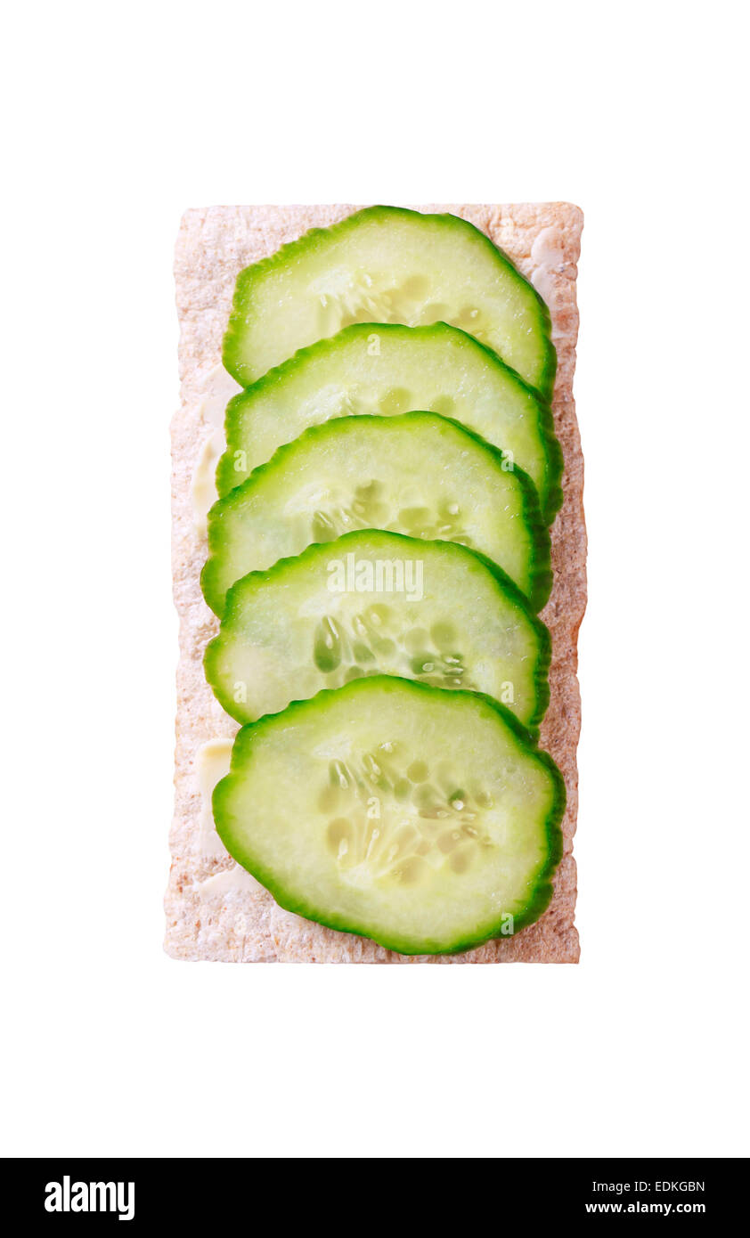 Slices of fresh cucumber on crispbread Stock Photo