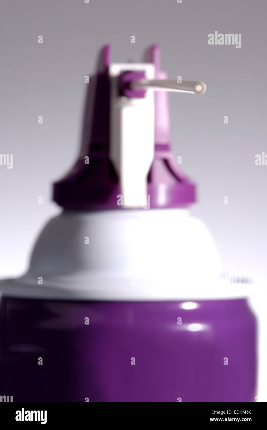 A close up view of a canned air sprayer, used for cleaning electronics