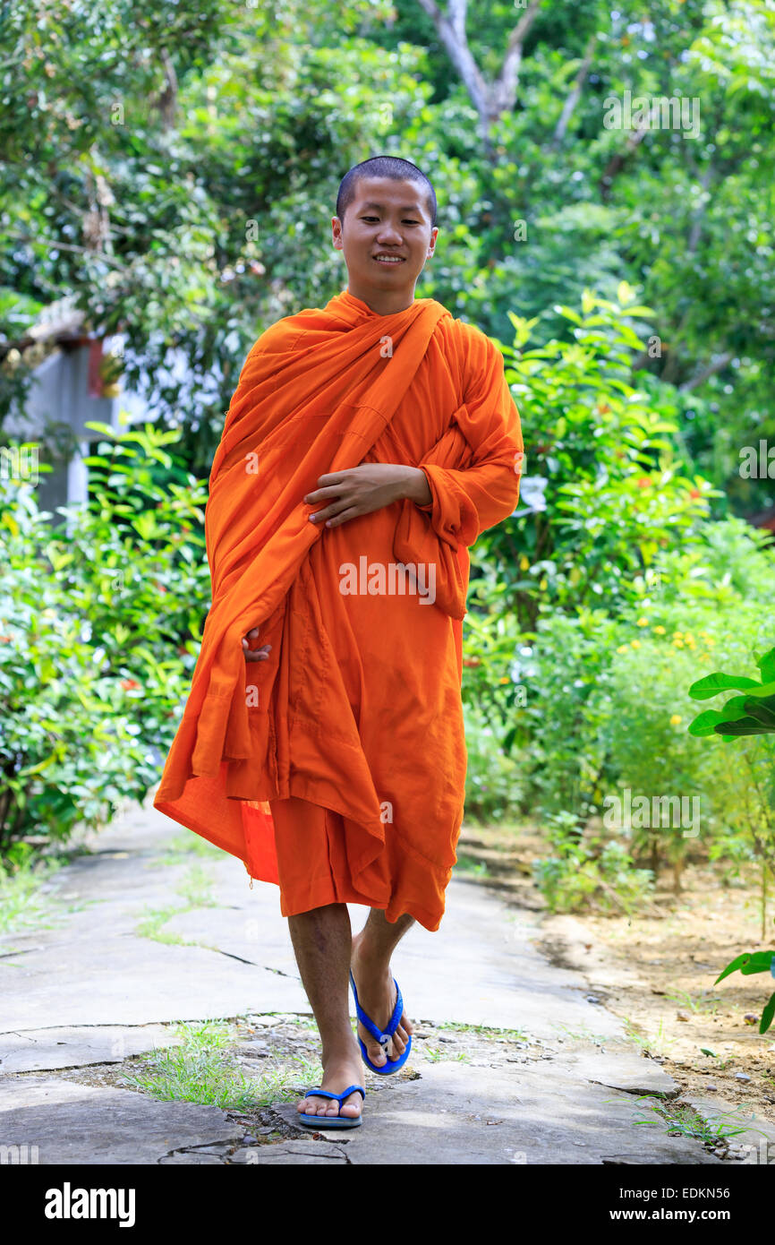 Young Buddhist Monk Walking And Smiling To The Camera Stock Photo - Alamy