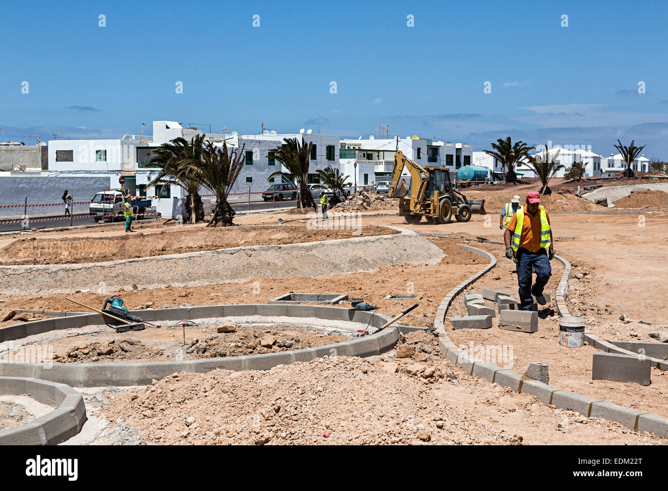 Construction workers laying foundations for paths, Playa Blanca