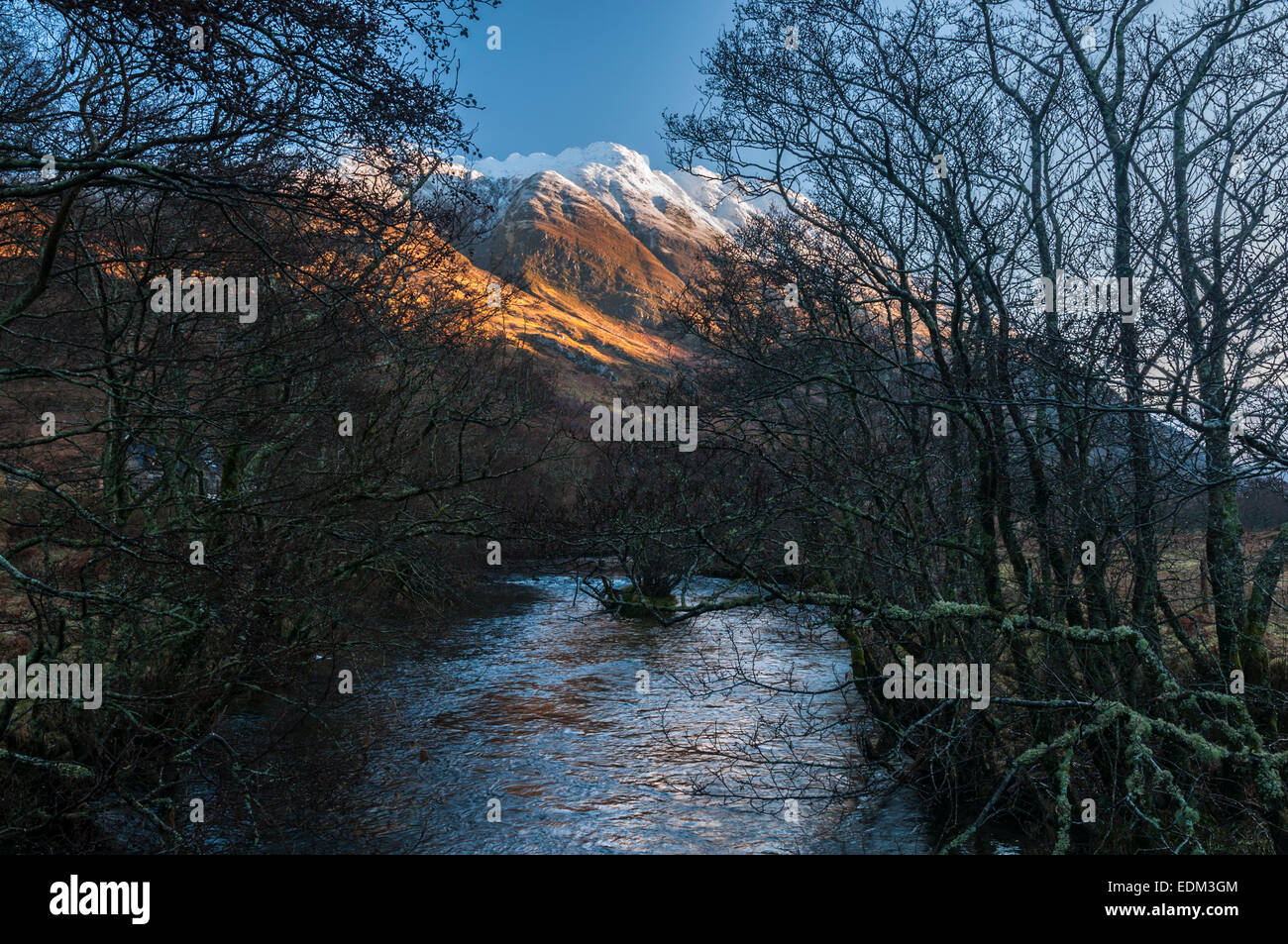 Looking up the River Croe towards Beinn Fhada or Ben Attow with Meall an Fhuarain Mhoir in the middle top of the picture. Stock Photo