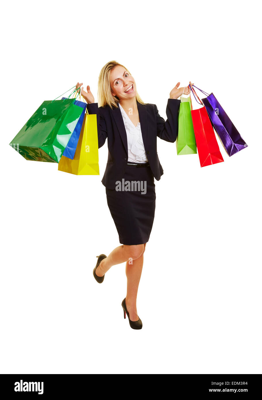 Happy young woman with many colorful shopping bags Stock Photo