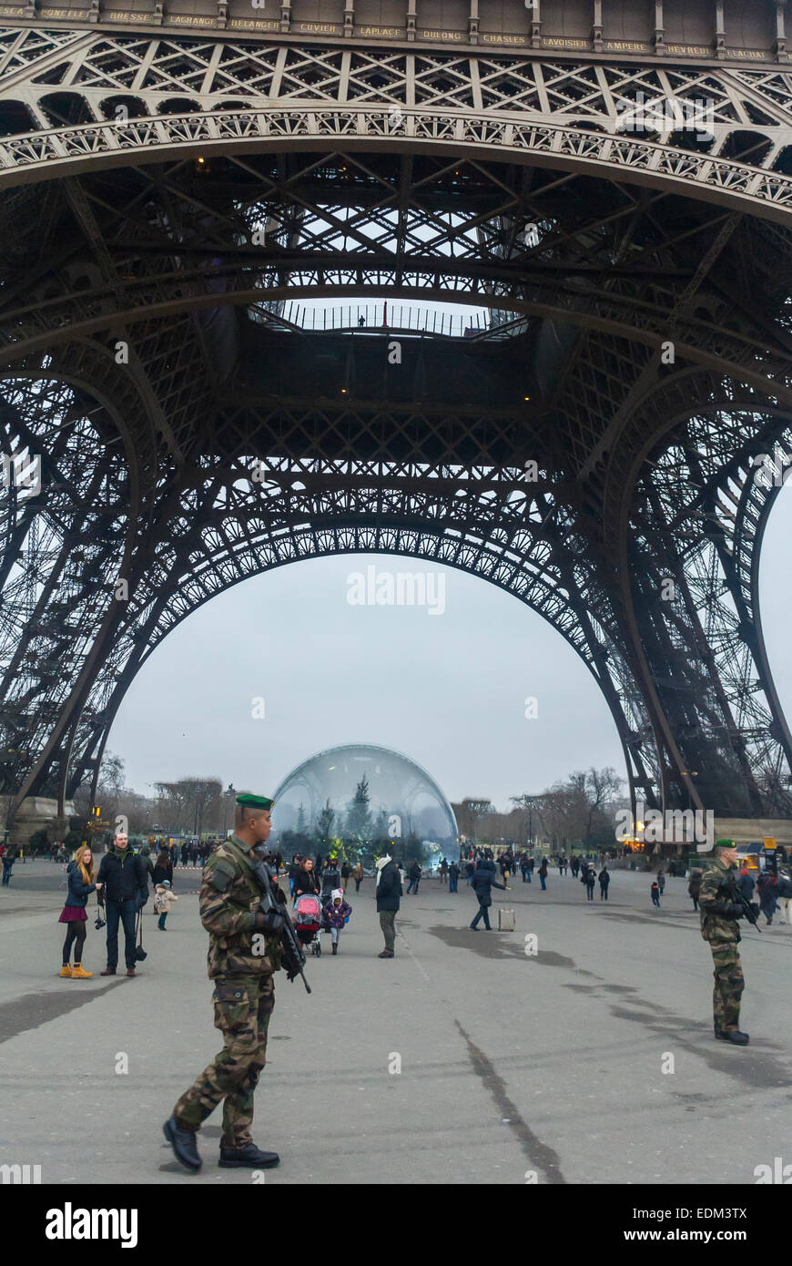 Paris, France. Security measures against terrorism after shooting attacks on French Newspaper, 'Charlie Hebdo' 'Eiffel Tower' Soldiers Patrolling on Street Stock Photo