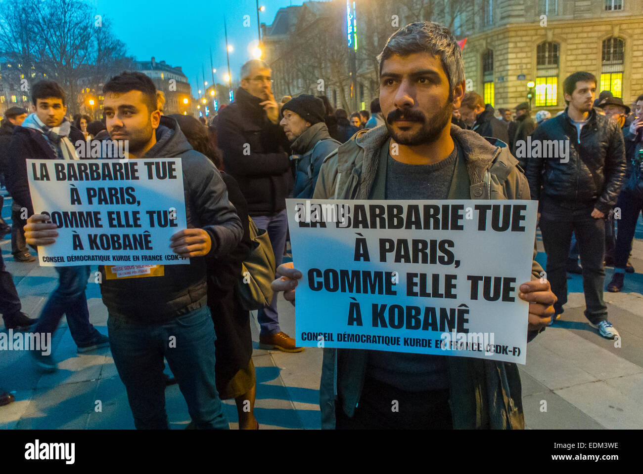 Paris, France. Demonstration against terrorism after attack on French Newspaper  'Charlie Hebdo', Kurds Holding Signs,International Immigrants, refugees men Stock Photo
