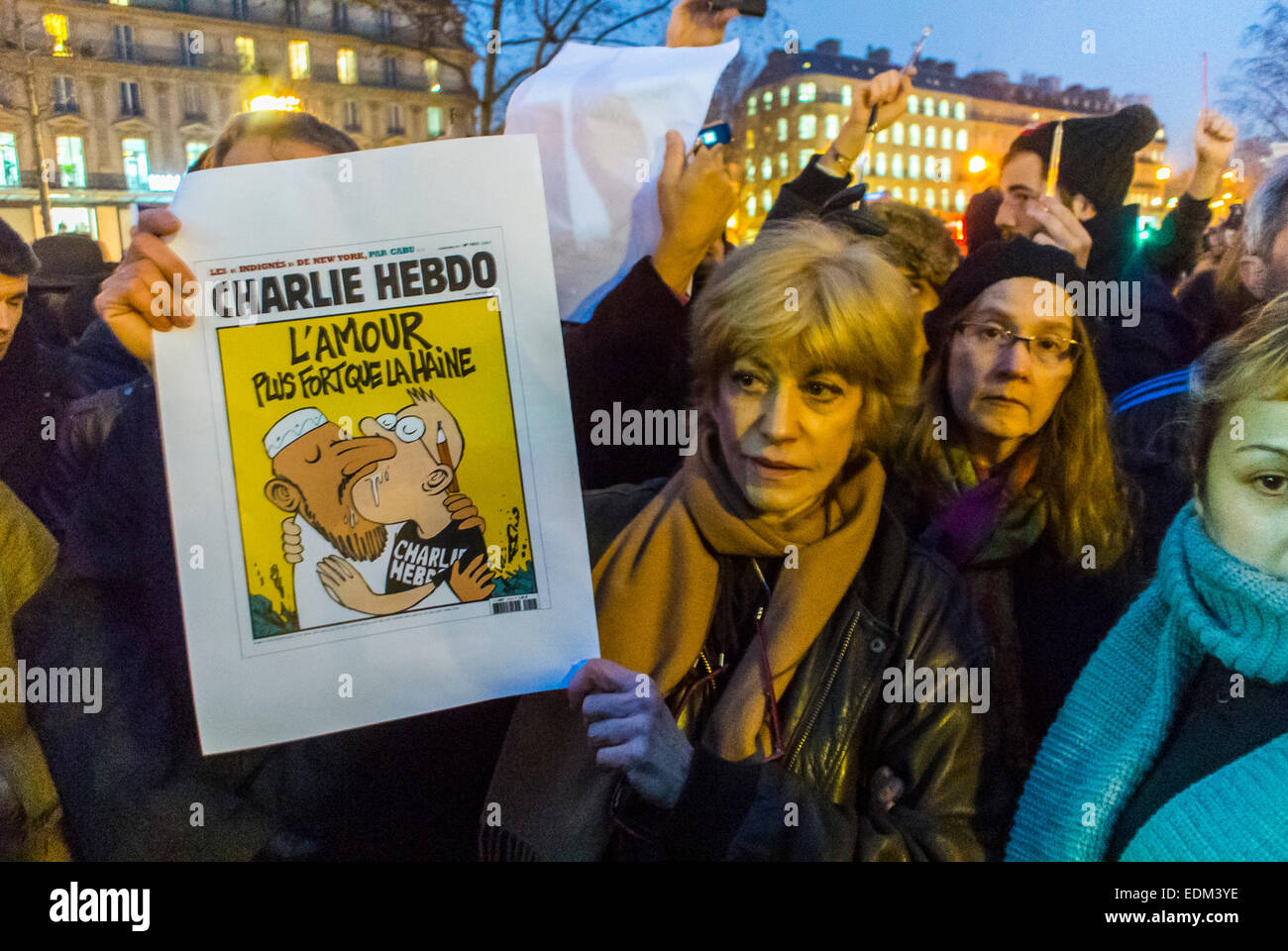 Paris, France, Demonstration Against Terrorism, After Shooting Attack on French Newspaper, 'Charlie Hebdo', Woman Holding Protest Sign, Paper Cover with Gay kiss. 'Love is Stronger than Hate' protest for justice, 'je suis Charlie paris' Stock Photo
