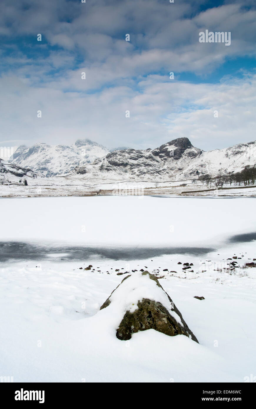 Blea Tarn, between Great Langdale and Little Langdale, frozen in winter. Cumbria, UK Stock Photo