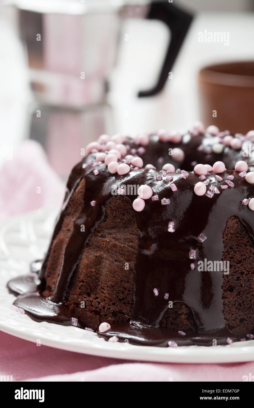 Chocolate bundt cake with pink decorations Stock Photo - Alamy