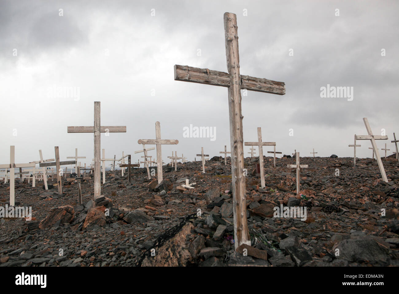 A cemetery in the town of Ittoqqortoormiit, East Greenland. On this northern latitude, the Earth has no soil. Stock Photo