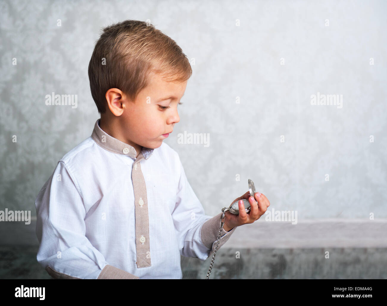 boy with the old clock in the hands of Stock Photo Alamy
