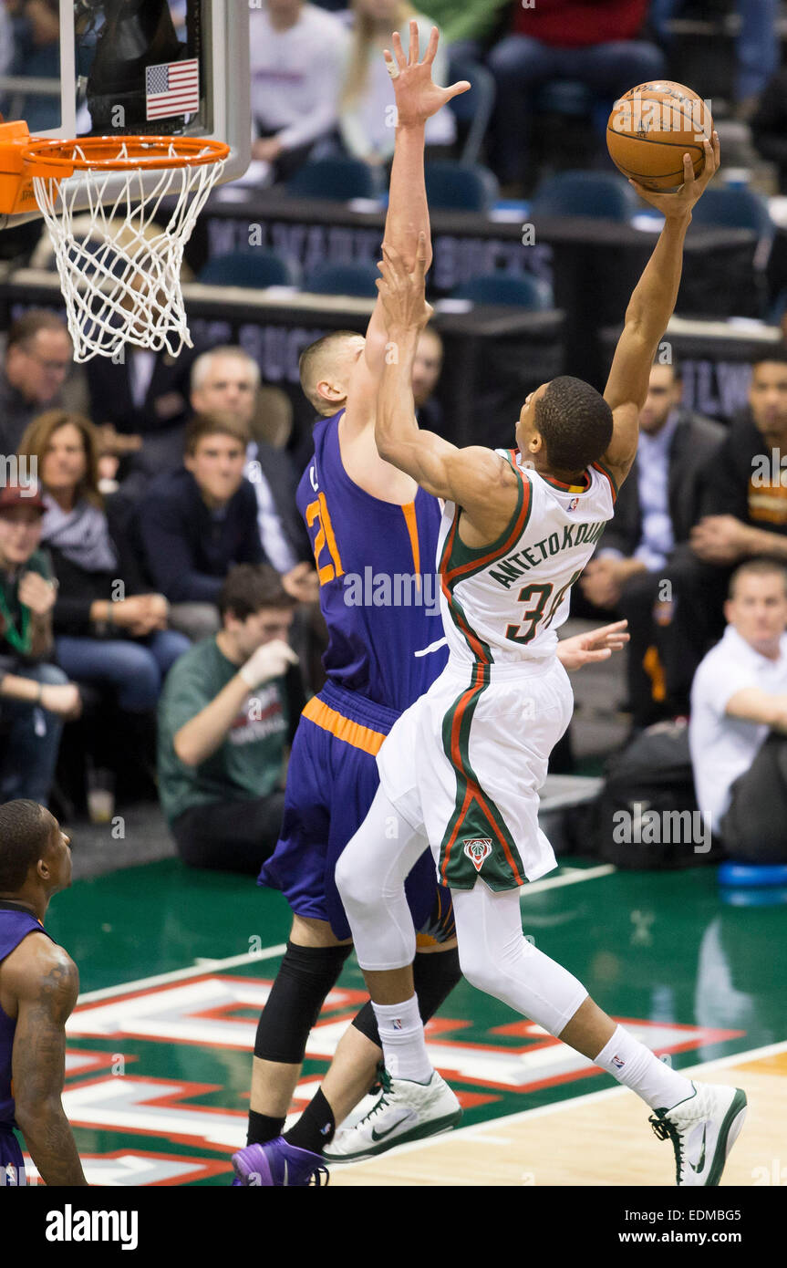 January 6, 2015: Milwaukee Bucks guard Giannis Antetokounmpo (34) is called for an offensive foul while going up for a shot on Phoenix Suns center Alex Len (21) during the NBA game between the Phoenix Suns and the Milwaukee Bucks at the BMO Harris Bradley Center in Milwaukee, WI. Suns defeated the Bucks 102-96. John Fisher/CSM Stock Photo