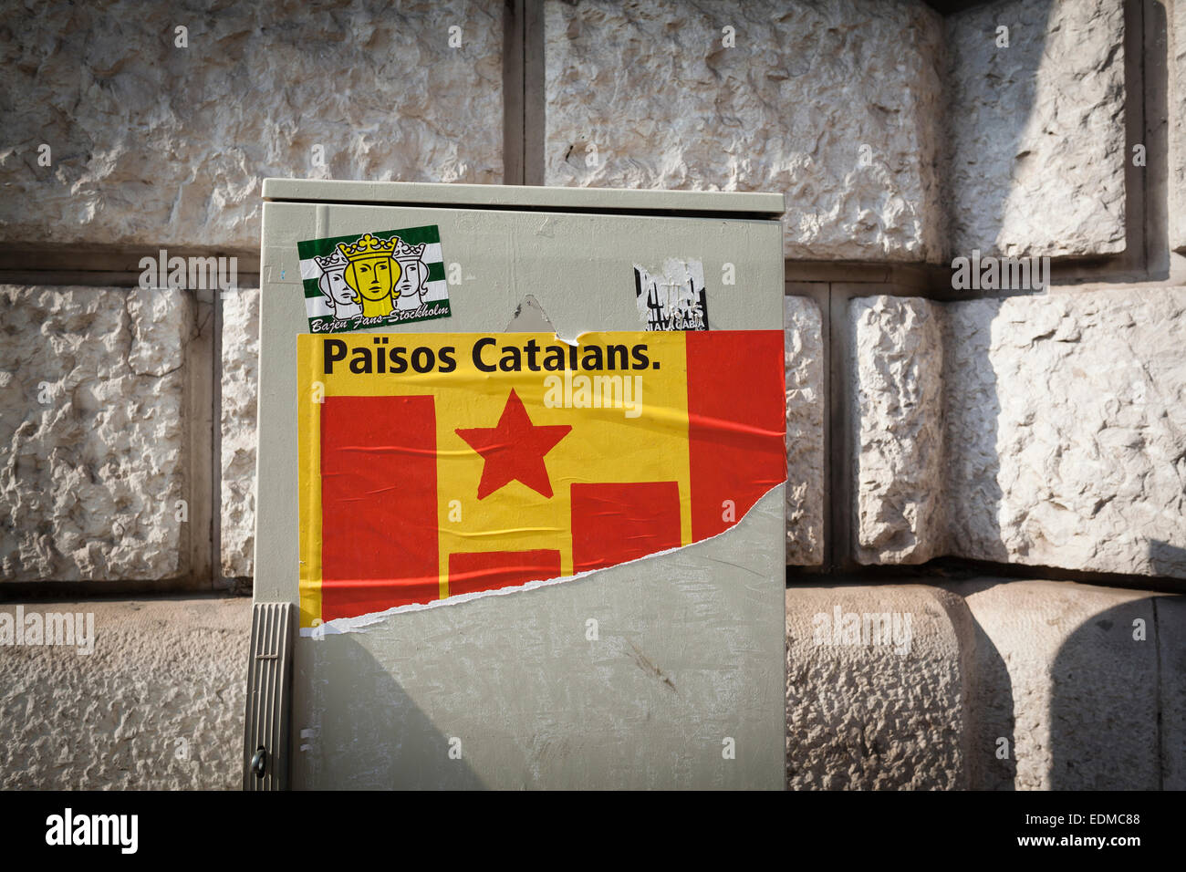 Catalan independence flag sticker on traffic lights control box. Barcelona. Catalonia. Spain. Stock Photo